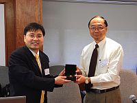 Prof. Henry N.C. Wong (right), Pro-Vice-Chancellor of the Chinese University of Hong Kong presents a souvenir to Mr. Colin Kong (left), Head, Division of Science and Technology, Beijing-Hong Kong Academic Exchange Centre